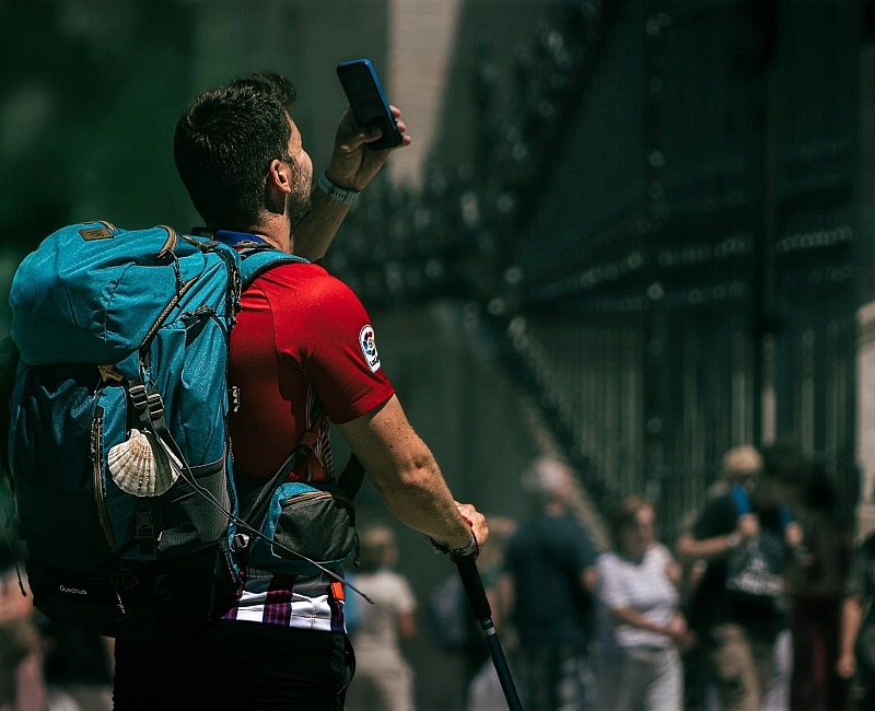 Pilgrim with a mobile phone